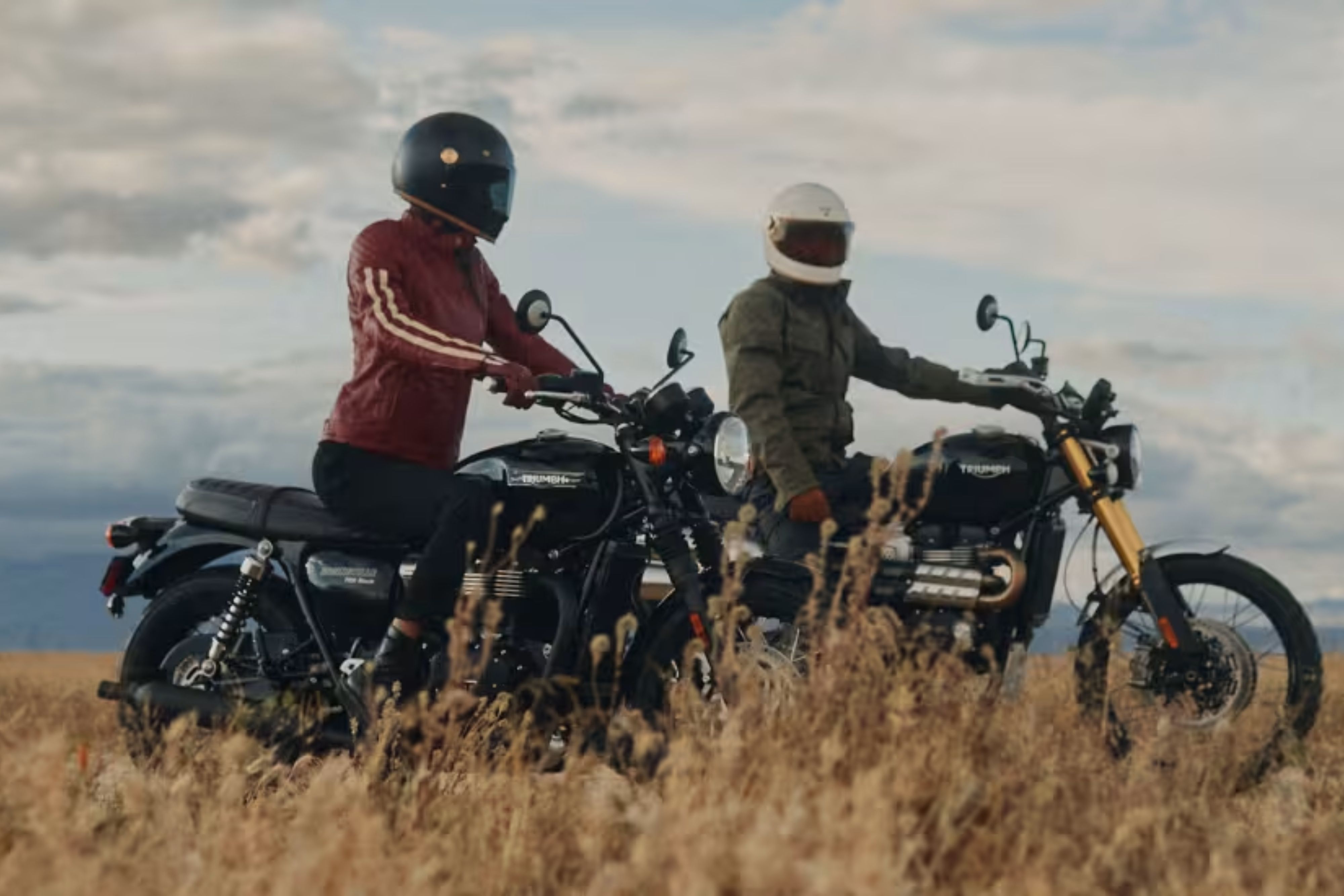 Two people on a motorbike wearing Triumph Heritage